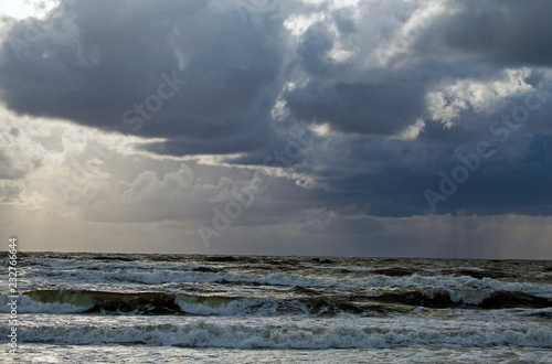 Beautiful evening clouds over the storming Bali Sea