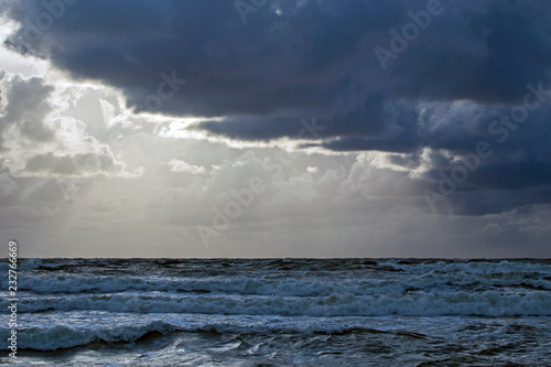 Beautiful evening clouds over the storming Bali Sea © avs_lt