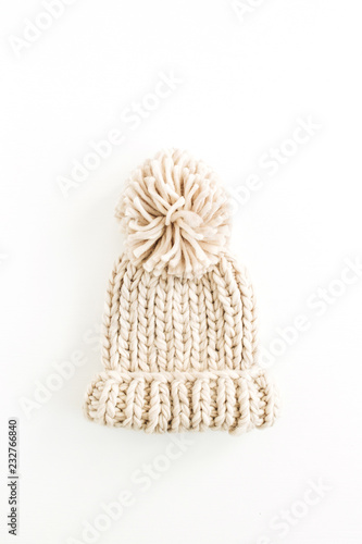 Warm female knitted hat isolated on white background. Flat lay, top view minimal fashion concept.