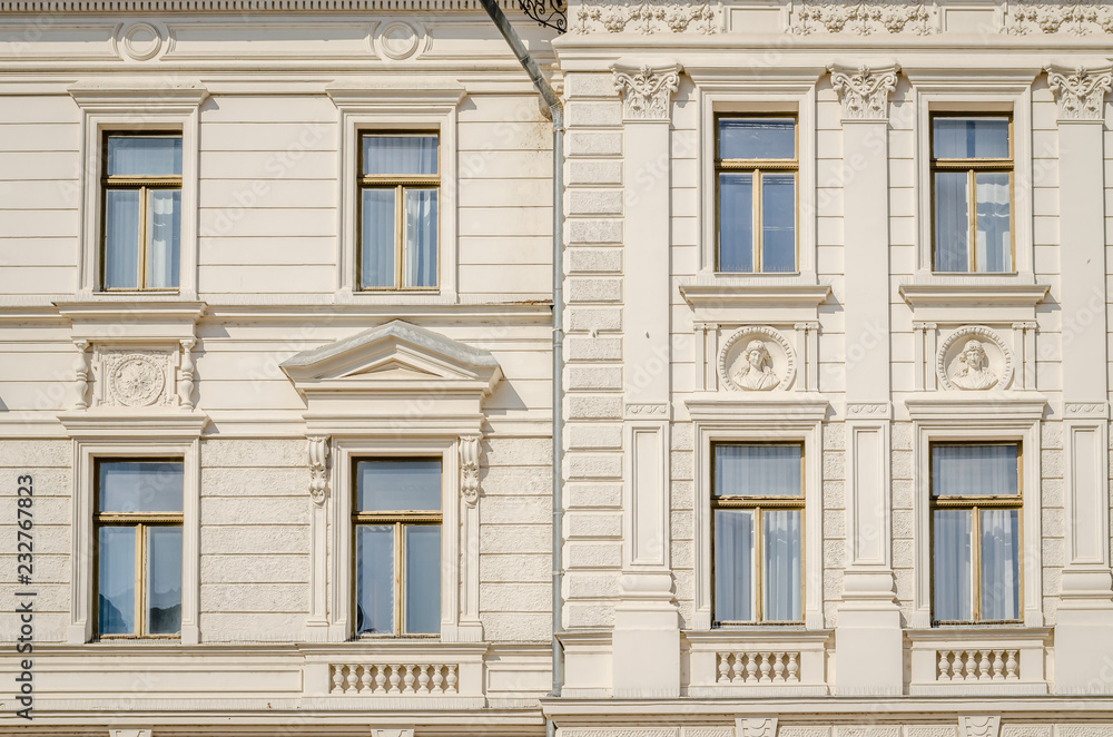 The windows of the municipal building in the town of Pecs The windows of the municipal building in the town of Pecs