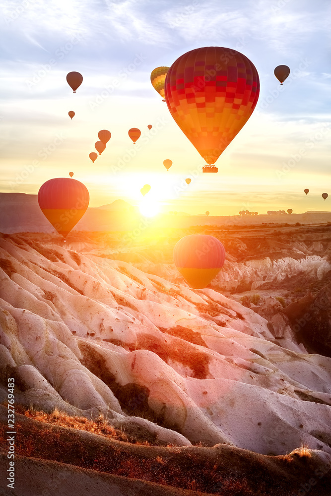 Obraz premium aerostat and sunset in the mountains of Cappadocia. Turkey