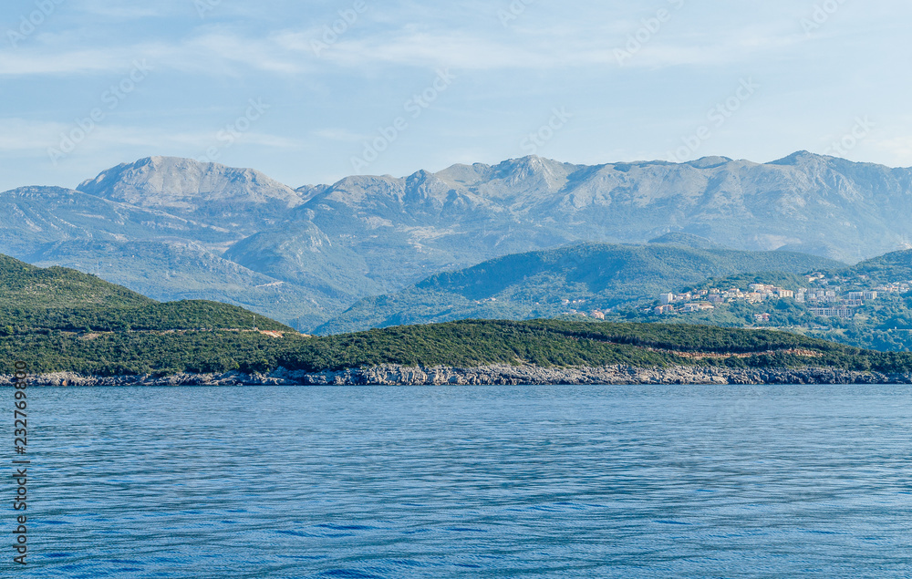 Budva Riviera in Montenegro, view from the sea on a sunny day