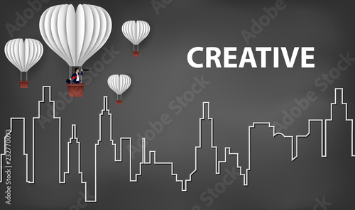 concept of business success, hot air balloon businessman holding binocular and paper plane white flying on sky between city on background blackboard. to the target. startup. creative idea