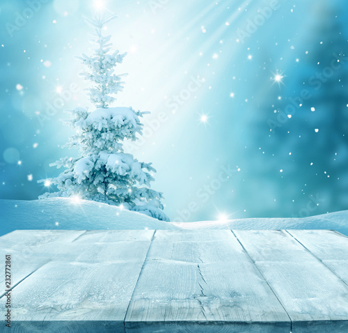 Merry christmas and happy new year greeting background with table .Winter landscape with fir tree branch