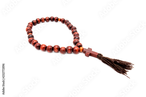 Hand goes through wooden rosary