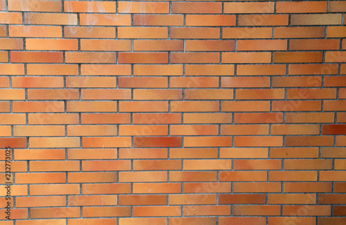 A wall of red bricks. Background - Red brick wall.