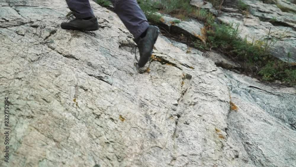 tourist woman in sneakers go up the mountains close up 50 fps tourist woman in sneakers go up the mountains close up 50 fps