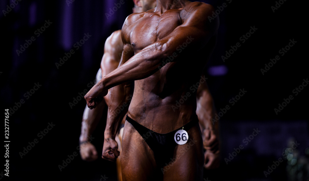 group athletes bodybuilders posing most muscular fitness competitions