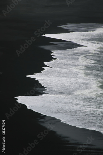 White water on black sand - view from Dyrholaey, Iceland