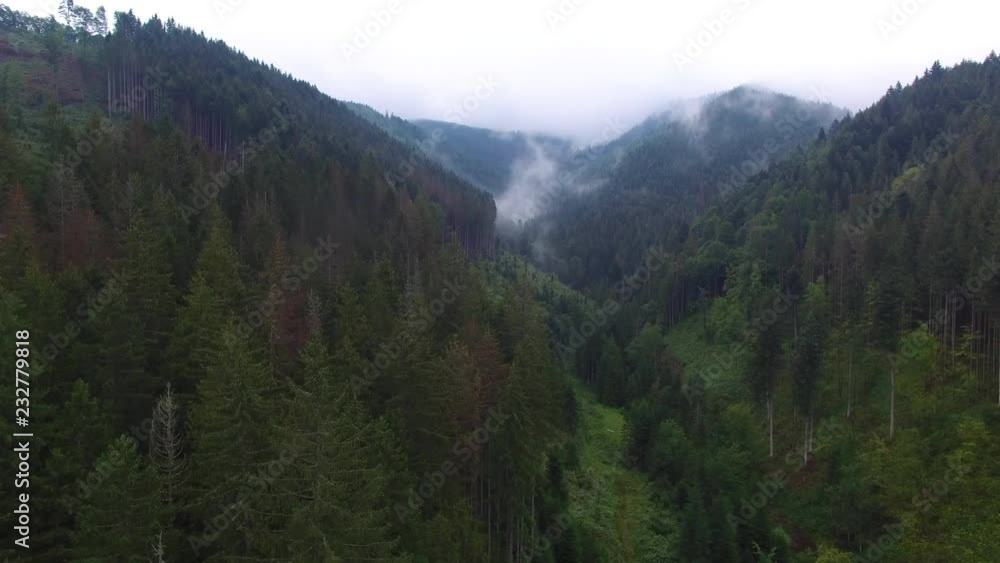 Aerial View. Flying over the high mountains in beautiful clouds . Aerial camera shot. Air clouds. Fog. Steam. Aerial View. Flying over the high mountains in beautiful clouds . Aerial camera shot. Air clouds. Fog. Steam.