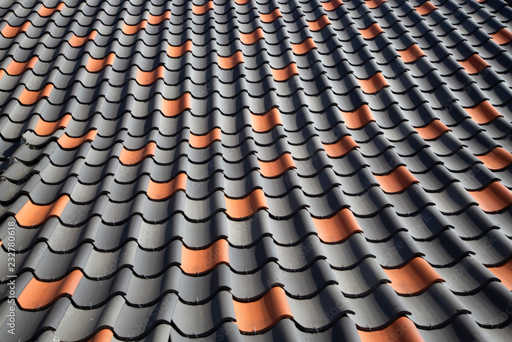 Obraz premium Rows of red and gray roof tiles on sheep fold of Maasduinen National Park, Limburg, Netherlands