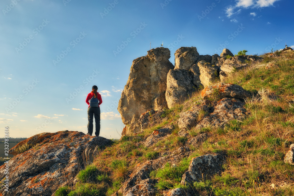 tourist on the rock. the girl looks at the picturesque canyon. spring Dniester
