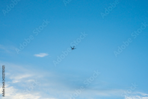 Airplane Flying in the Blue Sky