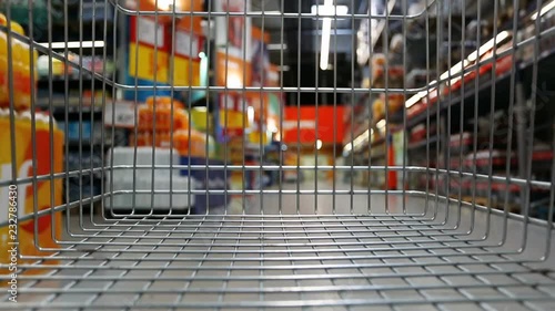 Time lapse of trolley moving through supermarket
 photo