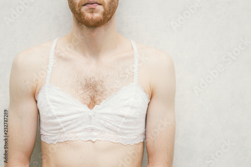 Obraz na płótnie Young man in white women's bra.