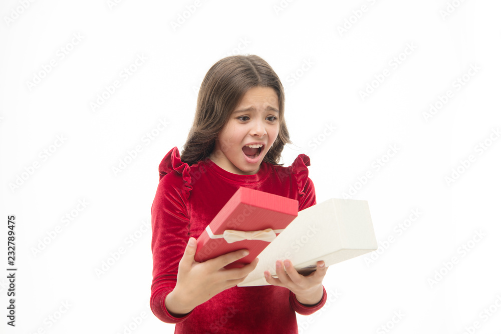 Small cute girl received holiday gift. What is inside. Worst toys and christmas gifts for kids. Kid little girl elegant dress curly hairstyle hold gift box. Child disappointed by unpacking her gift Small cute girl received holiday gift. What is inside. Worst toys and christmas gifts for kids. Kid little girl elegant dress curly hairstyle hold gift box. Child disappointed by unpacking her gift