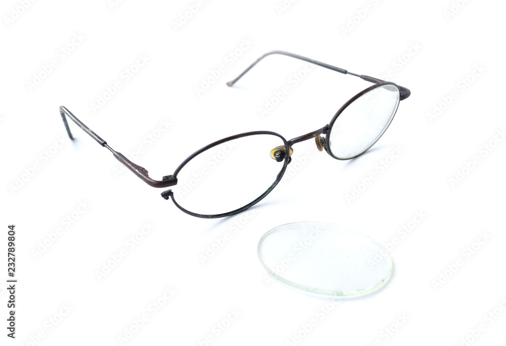Old glasses with broken brown lens and frame isolated on white background Old glasses with broken brown lens and frame isolated on white background