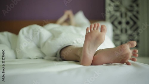 Close up on a baby feet in bed