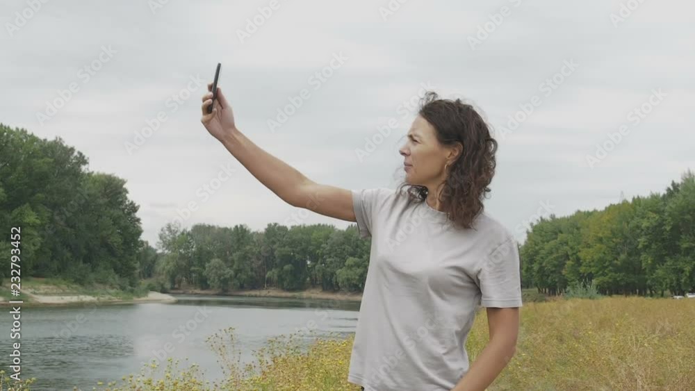 No signal. Loss of phone signal. Woman on nature catches the signal of a mobile phone. No signal. Loss of phone signal. Woman on nature catches the signal of a mobile phone.