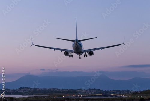 the plane lands in the evening to the runway of the airport Ioannis Kapodistrias of greek island Corfu