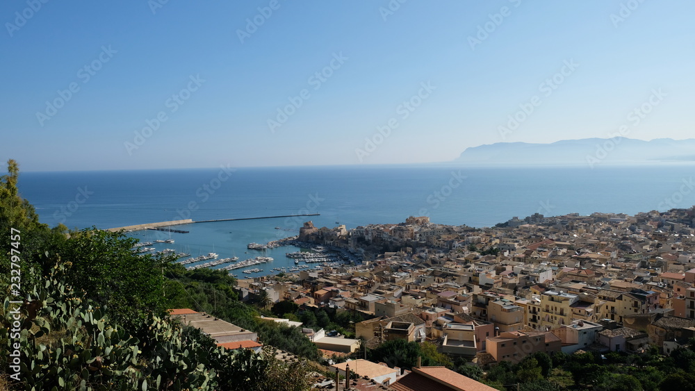 Town of Castellammare del Golfo, Province of Trapani, Sicily. Early in the morning, the small town is quiet yet, and the mist is still visible over the gulf of Castellammare
