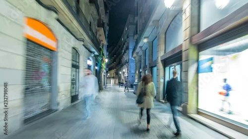Fast walk through narrow street in the Old Town timelapse hyperlapse, Barcelona. Gothic district illuminated at night photo
