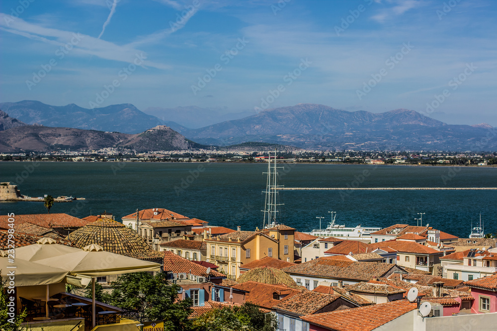 Mediterranean landscape district south small city view on waterfront of sea bay and with mountains horizon background scenery in colorful summer day time