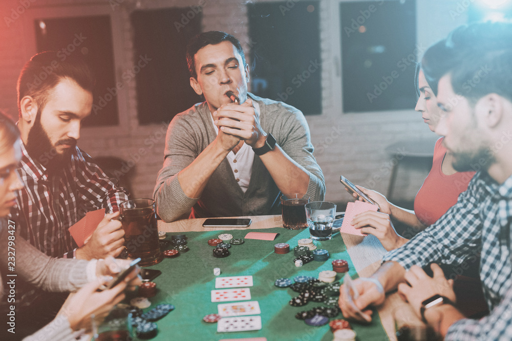 Young Friends Playing Poker on Party at Home. Young Friends Playing Poker on Party at Home.