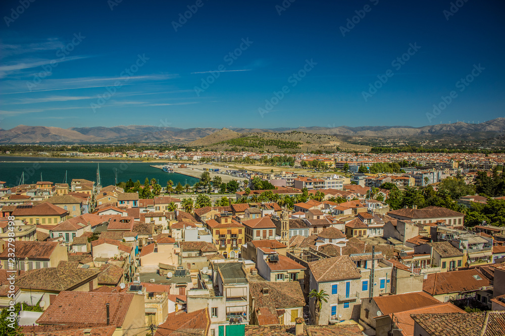 Mediterranean landscape district south small city view on waterfront of sea bay and with mountains horizon background scenery in colorful summer day time