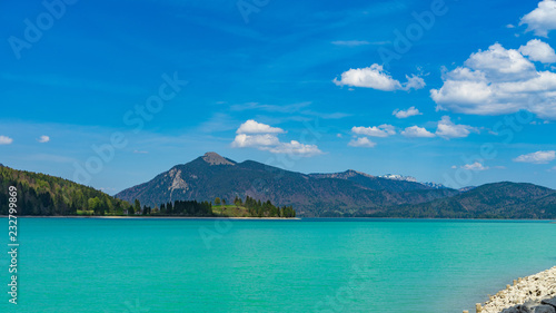 island in the sea with mountains