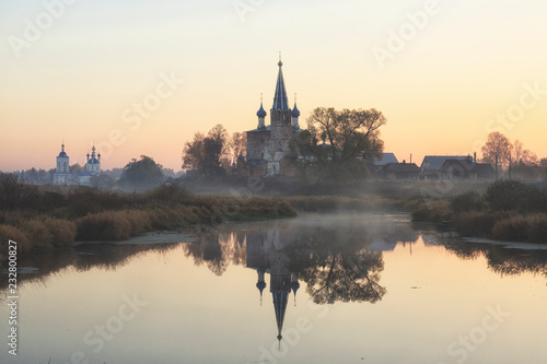 Annunciation Monastery in fog sunrise. Dunilovo village. Ivanovo region, Russia
