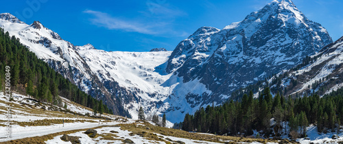 view of alps in winter in a glacier valley