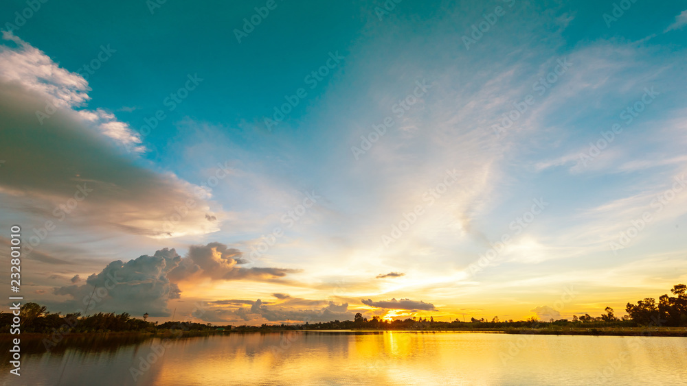Scenery sunset over calm lake landscape panorama