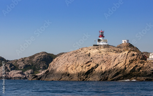 Navigation at sea. Lighthouse on a cliff