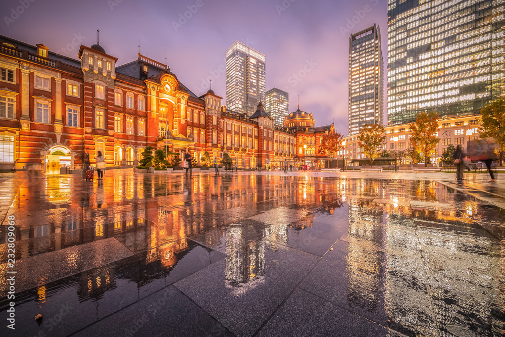 Tokyo station with reflection in raining day
