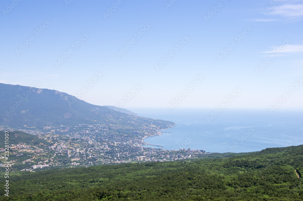 Resort city by the sea. Russia, Republic of Crimea, Yalta. 06.13.2018: View of Yalta and the Black Sea from Mount Ai-Petri Resort city by the sea. Russia, Republic of Crimea, Yalta. 06.13.2018: View of Yalta and the Black Sea from Mount Ai-Petri