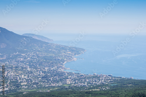 Resort city by the sea. Russia, Republic of Crimea, Yalta. 06.13.2018: View of Yalta and the Black Sea from Mount Ai-Petri © vadim_orlov
