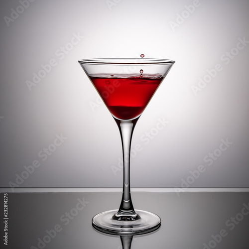 glass of wine on the glass table