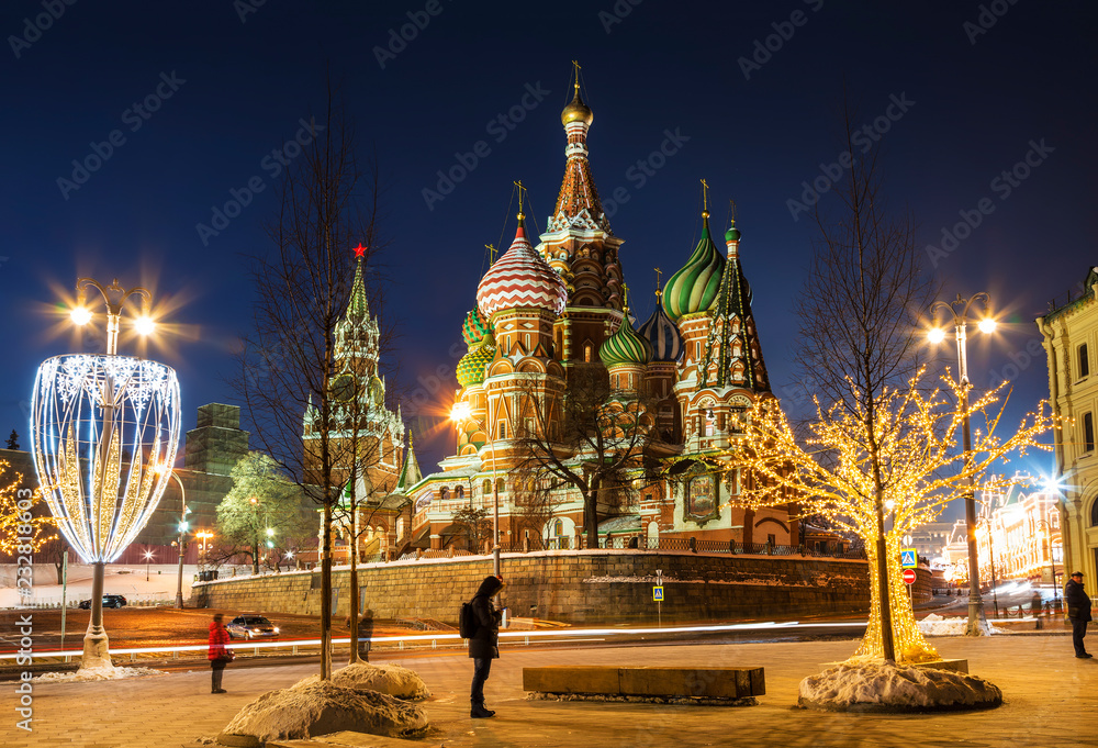View of St. Basil's Cathedral and the Kremlin in new year's evening. Moscow, Russia