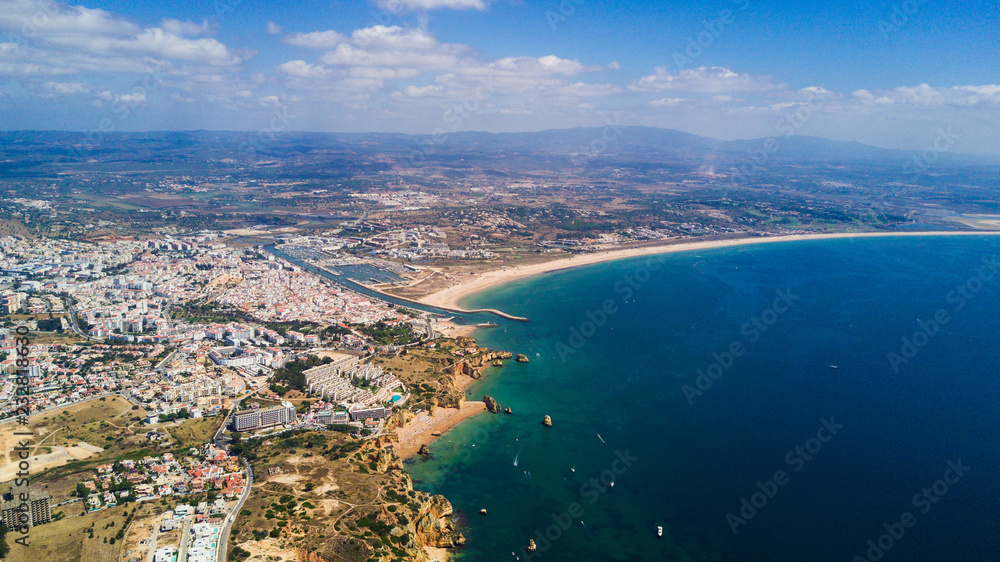 Naklejka premium Aerial view of beautiful cliffs and beach near Lagos city in Algarve coast at Portugal