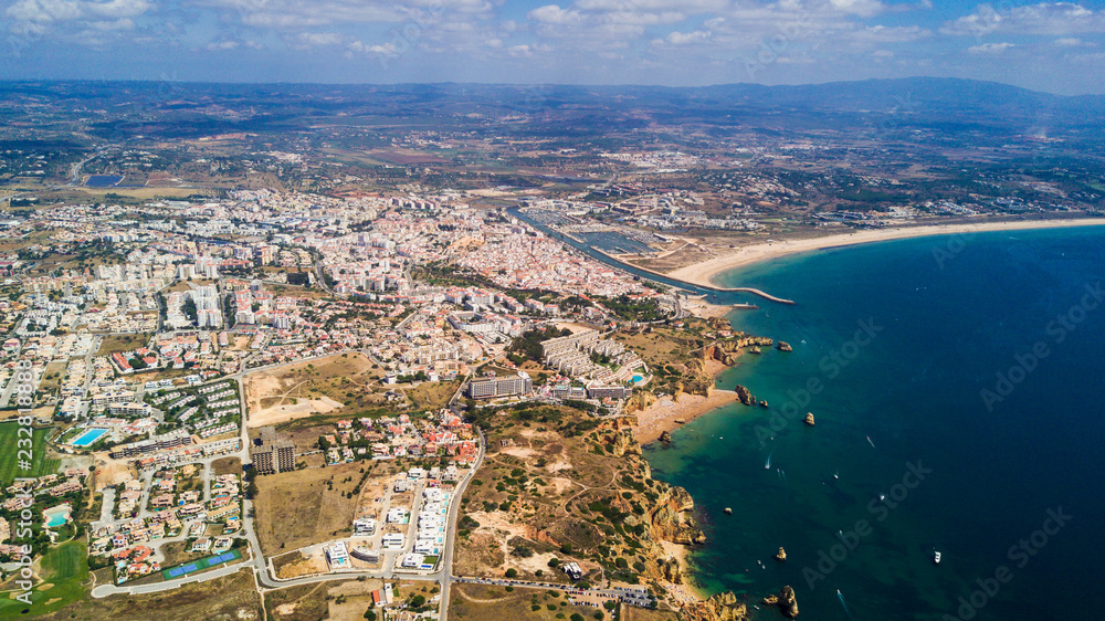 Aerial view of beautiful cliffs and beach near Lagos city in Algarve coast at Portugal