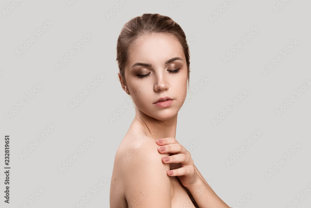 Beautiful Young Woman with Clean Fresh Skin . Facial treatment . Cosmetology , beauty and spa . body care Beautiful Young Woman with Clean Fresh Skin . Facial treatment . Cosmetology , beauty and spa . body care