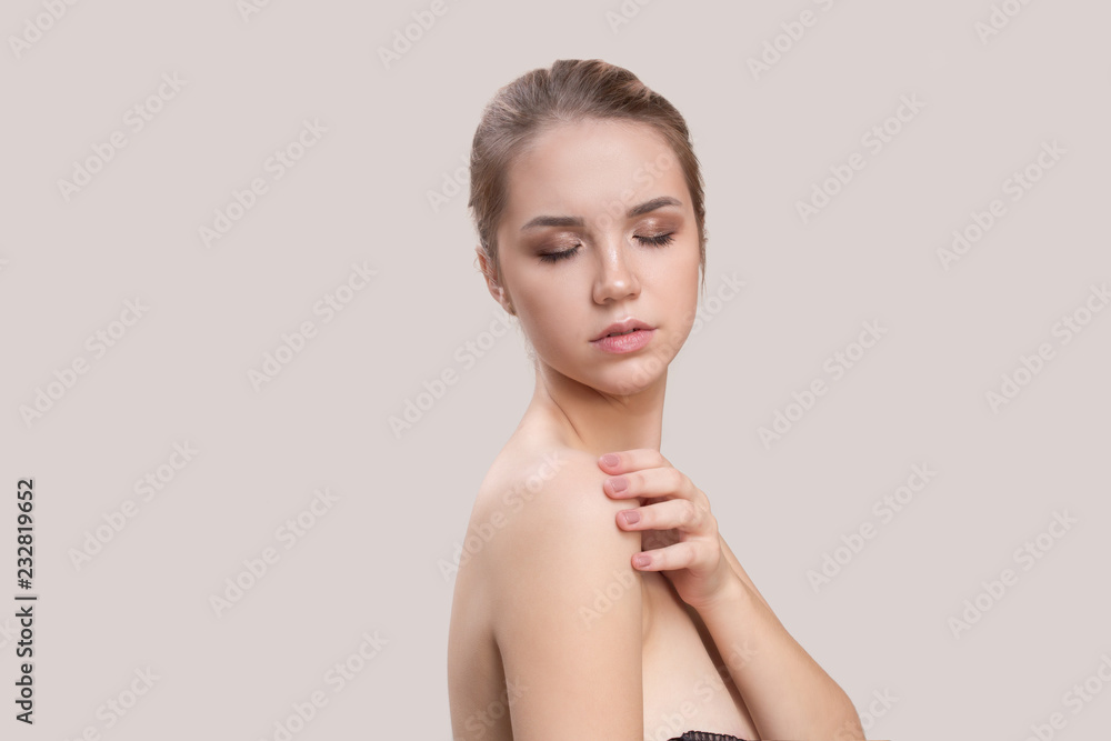 Beautiful Young Woman with Clean Fresh Skin . Facial treatment . Cosmetology , beauty and spa . body care Beautiful Young Woman with Clean Fresh Skin . Facial treatment . Cosmetology , beauty and spa . body care