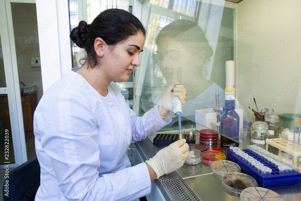 Young scientist works in modern biological lab Young scientist works in modern biological lab