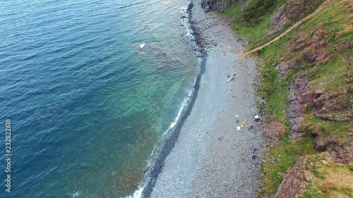 Wallpaper Mural top aerial coastline view and waves crashing on rocky cliff shoreline Torontodigital.ca