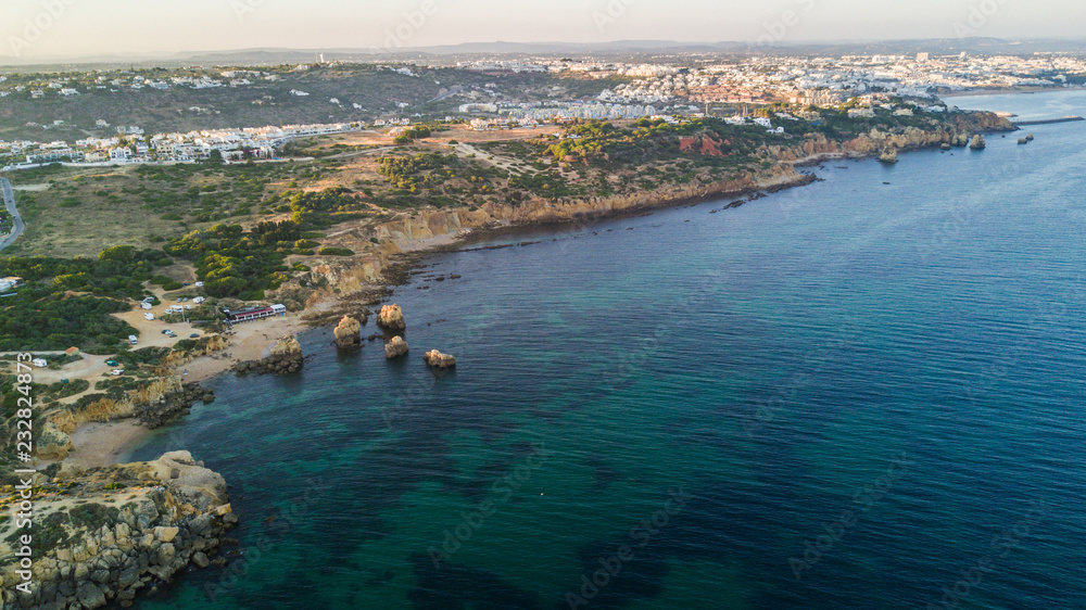 Aerial view on sunset of the Sao Rafael beach, Algarve coast, Portugal. Concept for above beach of Portugal. Summer vacations