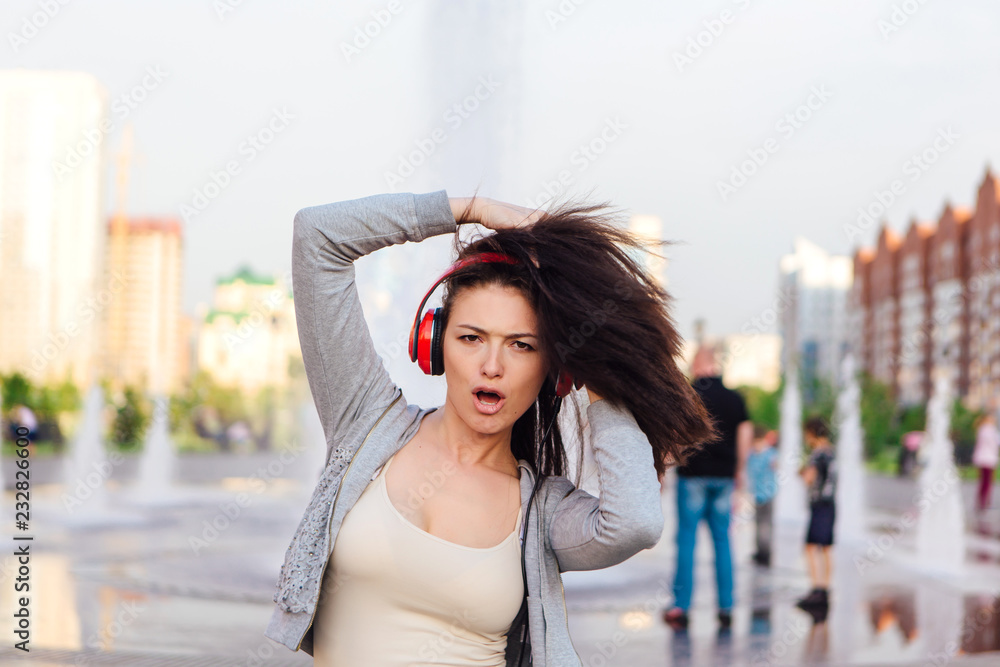 Fototapeta premium Girl listening to music streaming with headphones.