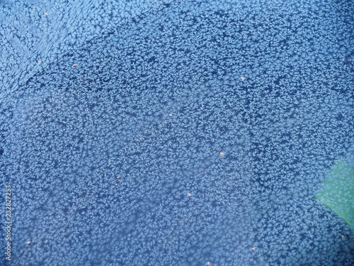 Ice crystals on the windshield of a car. Frost.