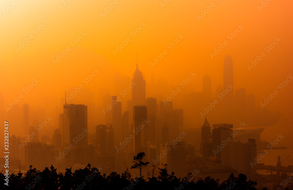 Silhouette of skyline of Hong Kong city with misty.
