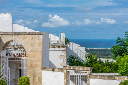 A view of the Adriatic sea and traditional white houses in Ostuni in the Puglia region of Italy
